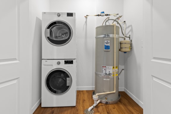 a laundry room with a washing machine and a water tank  at Yellowstone Landing, Belgrade, MT, 59714