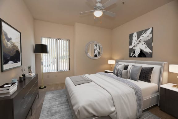 a bedroom with a white bed and a ceiling fan at Winding Commons Senior Living, Carmichael, 95608
