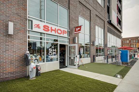 Storefront with a red sign at 747 Apartments, Indianapolis, 46202