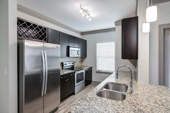 A wine rack in a large kitchen at Adara, Overland Park, Overland Park, KS