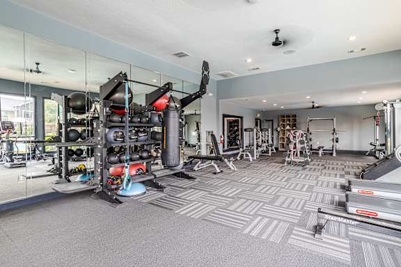 well-equipped gym at Avenues at Shadow Creek Ranch Apartments, Pearland, Texas