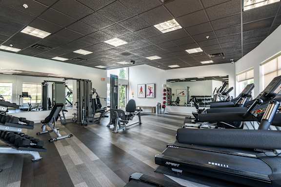 A gym with treadmills, weights, and exercise equipment. at CityView, North Kansas City, Missouri