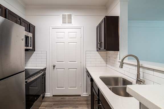 Kitchen with sink and faucet at Grand Villas at Cinco Ranch, Katy, 77494