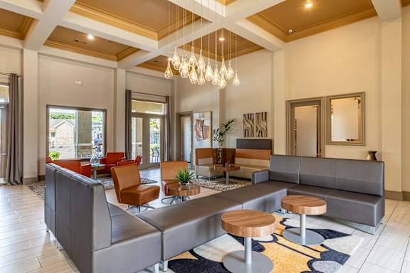 Common room with large couch at Grand Villas at Cinco Ranch, Katy