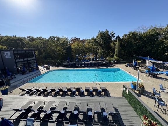 an aerial view of a swimming pool with lounge chairs at The Boulevard, Roeland Park, KS, 66205