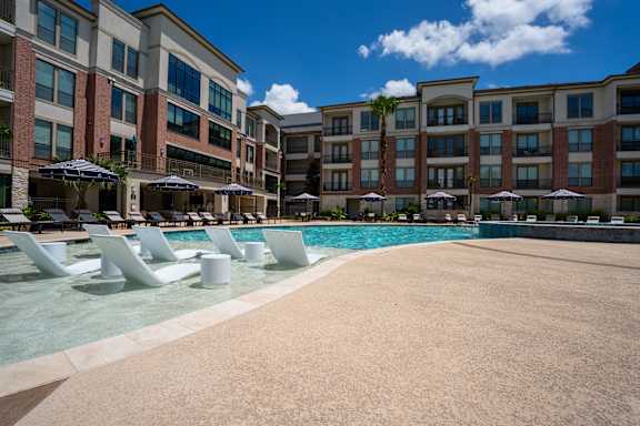 Lounge chairs by the pool at Imperial Lofts, Sugar Land, 77498
