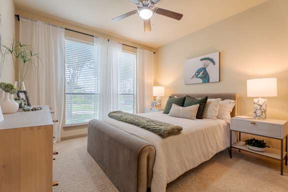 Bedroom with ceiling fan at Imperial Lofts, Texas, 77498