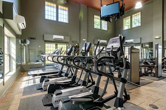 A gym with treadmills and elliptical machines. at London House Apartments, Lenexa, KS, 66215