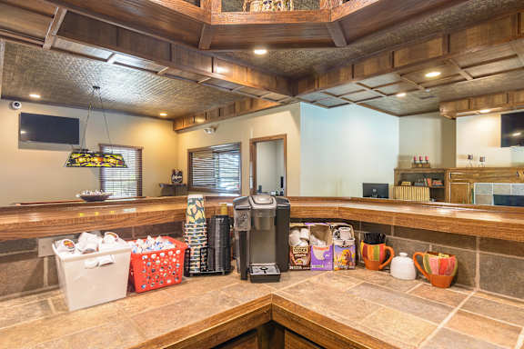 A kitchen with a counter and a coffee maker. at London House Apartments, Lenexa, Kansas