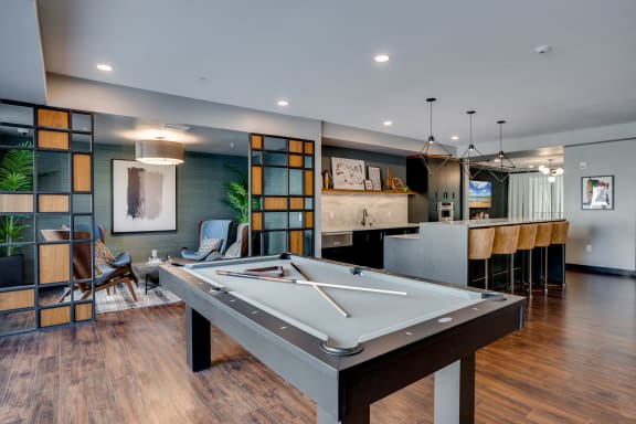 play a game of pool in our clubhouse at our apartments at Marquee, Minneapolis, MN, 55403