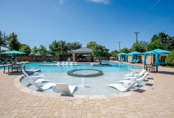 a large swimming pool with chairs around it at Discovery at Craig Ranch, McKinney, Texas