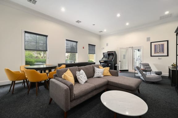 a living room with a couch and a table and chairs at Sovereign at Overland Park, Kansas