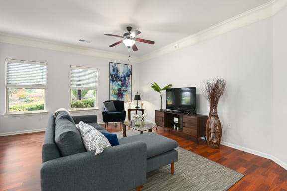 a living room with a couch and a tv at Sovereign at Overland Park, Overland Park, 66213