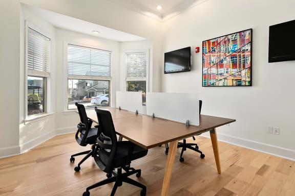 a conference room with a wooden table and chairs at Sovereign at Overland Park, Overland Park Kansas