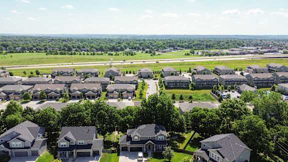 A suburban neighborhood with houses and trees.