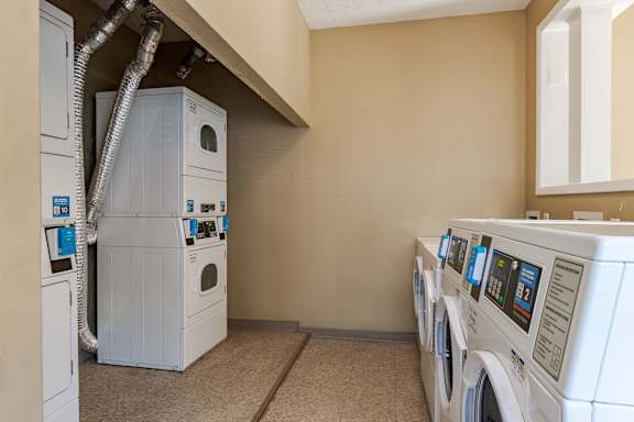Row of washers and dryers in Laundry Room at Springhill Apartments, Kansas