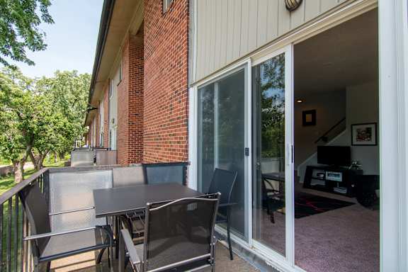 A patio with a table and chairs is shown.