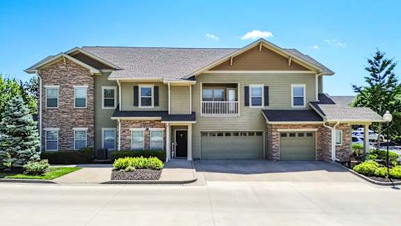 A two-story house with a garage on the right side at Sovereign at Overland Park Apartments, Kansas