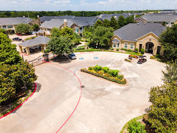 A residential area with houses and a parking lot at Waterstone at Cinco Ranch Apartments, Katy Texas