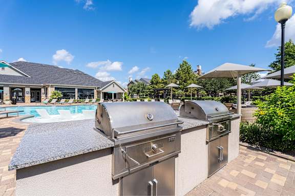 BBQ near pool area at Waterstone at Cinco Ranch Apartments, Katy, 77450