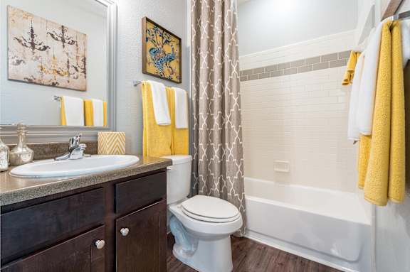 Bathroom with wooden storage at Waterstone at Cinco Ranch Apartments, Katy, TX 77450