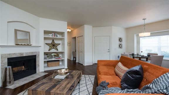 Village at Main Street | Living Room  with Built In Shelving and Fireplace