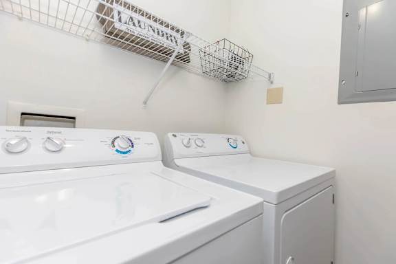 A laundry room with a washer and dryer.