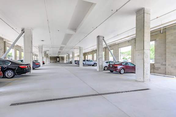 A parking garage with cars parked in it.