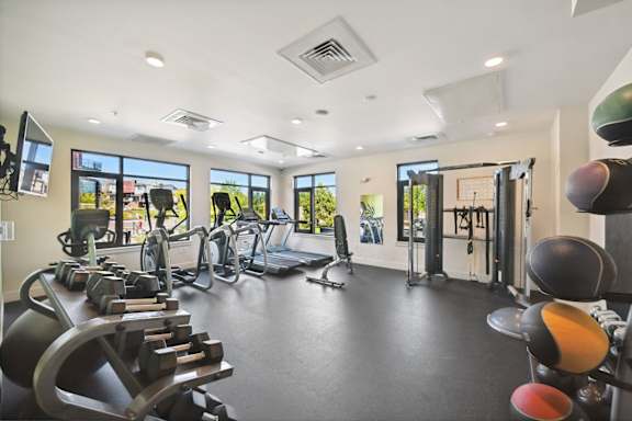 Gym with treadmills and other exercise equipment at Delo Apartments, Louisville, CO, Colorado, 80027