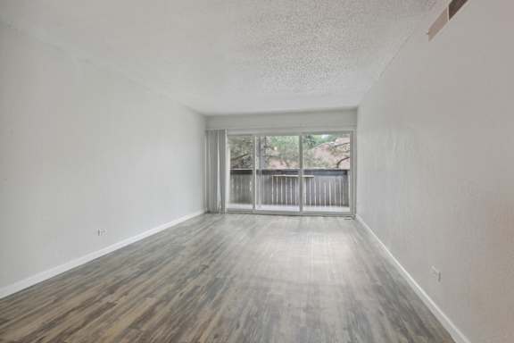 Vacant Room with Glass Windows at Lakeridge Terrace Apartments, Denver