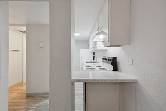 Kitchen with White Countertop at Lakeridge Terrace Apartments, Denver, CO