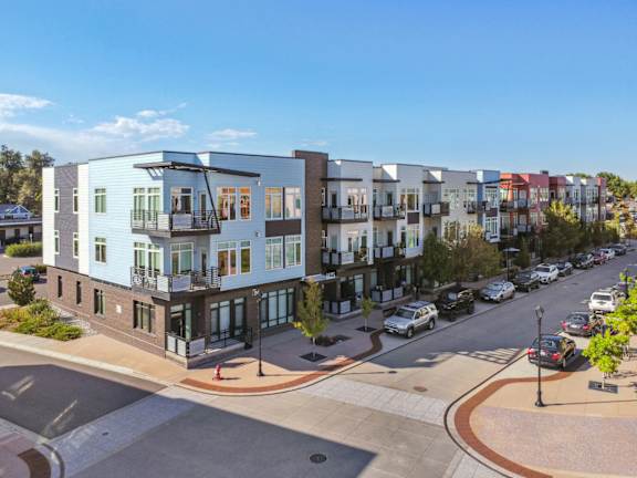 Aerial view of the building with parking area at Delo Apartments, Colorado, 80027