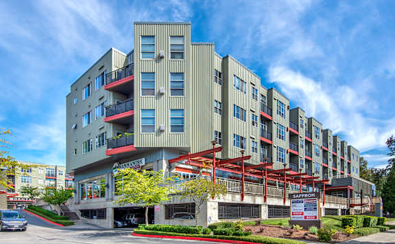 A large building with a red awning in front of it.