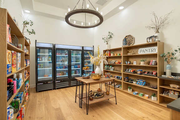 A pantry section in a store with a variety of food items on display.