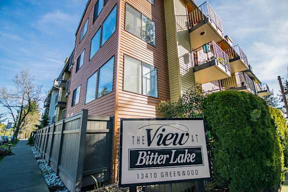 an apartment building with a sign for the view at bitter lake