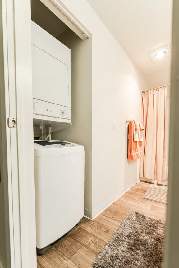 a small laundry room with a washer and dryer in it