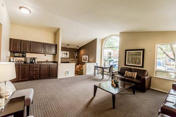 a living room with a couch and a table at Cambridge on Seventh, Puyallup, WA, 98372