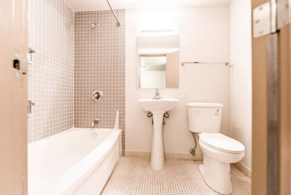 a bathroom with a sink toilet and a bath tub&#xA0;at Cosmopolitan, Seattle, Washington