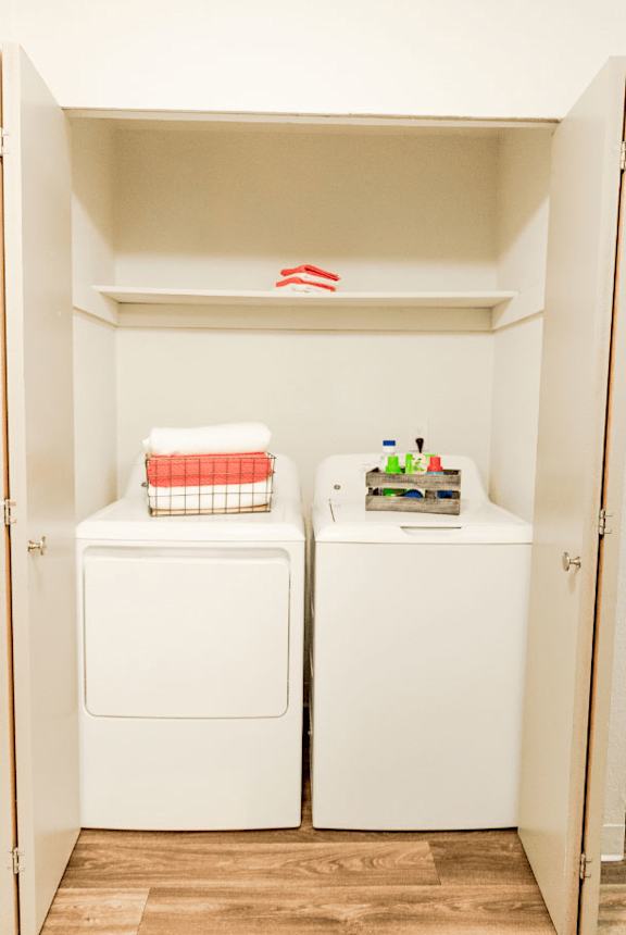 A small laundry room with a washer and dryer. at Crown Pointe, Lakewood, WA