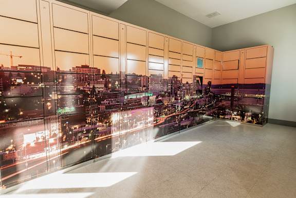 a rendering of a cityscape on a wall in a room at Northpoint Apartments, Tacoma, Washington