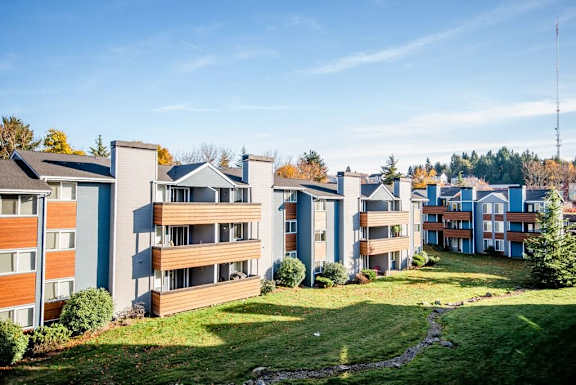 A row of modern apartment buildings with green lawns in front. at Northpoint Apartments, Tacoma, WA, 98407