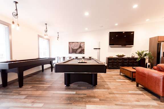 a game room with a pool table and a television at Notch 8, Tacoma, WA, 98444