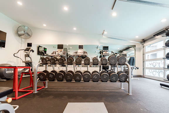 a row of tires on a rack in a gym at Notch 8, Tacoma, 98444