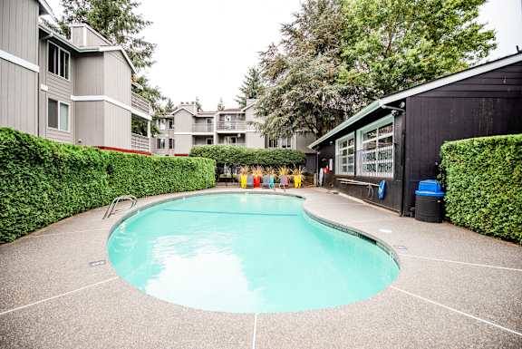 a swimming pool in front of an apartment building at Notch 8, Tacoma, Washington