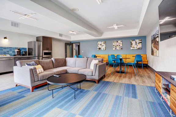 a living room with couches and chairs and a table