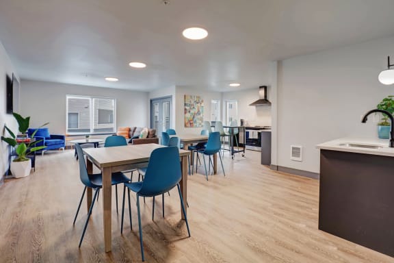 the preserve at ballantyne commons clubhouse with dining table and living room