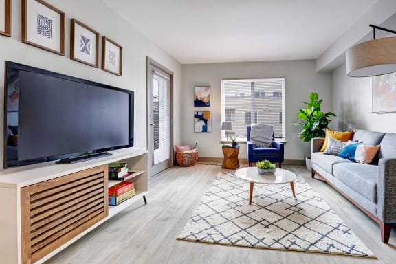 a living room with a couch and a tv