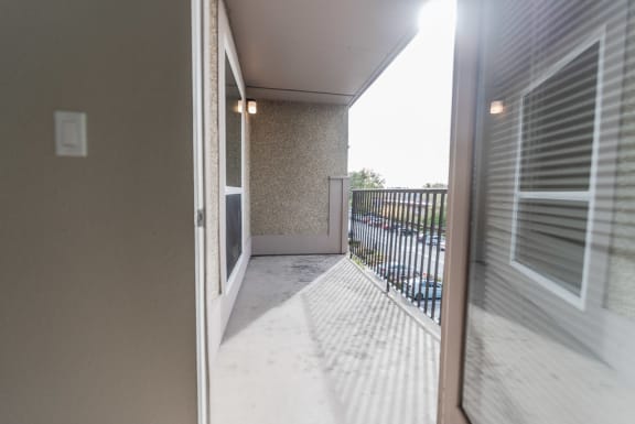 the view of the balcony from the living room of an apartment at The Aviator, Renton, 98055