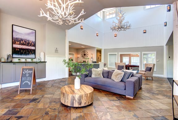 a living room with a couch and a coffee table at Deer Creek Apartments, Puyallup, WA