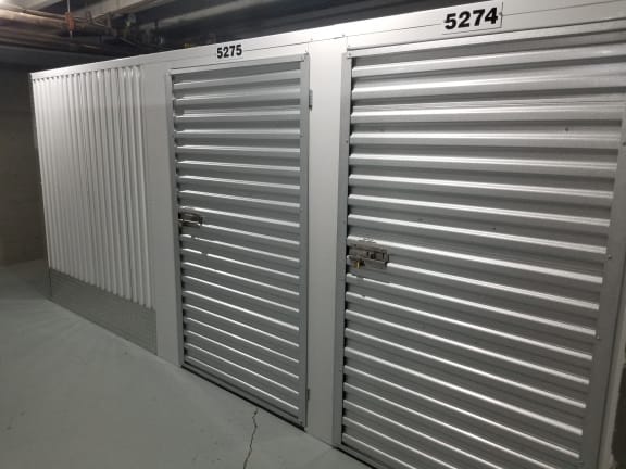 two roll up steel doors in a garage